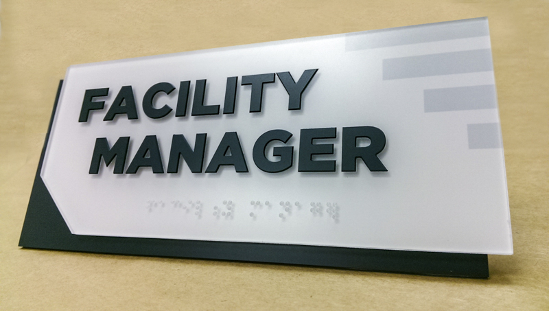 Facility manager ADA compliant wayfinding by Pensacola Sign