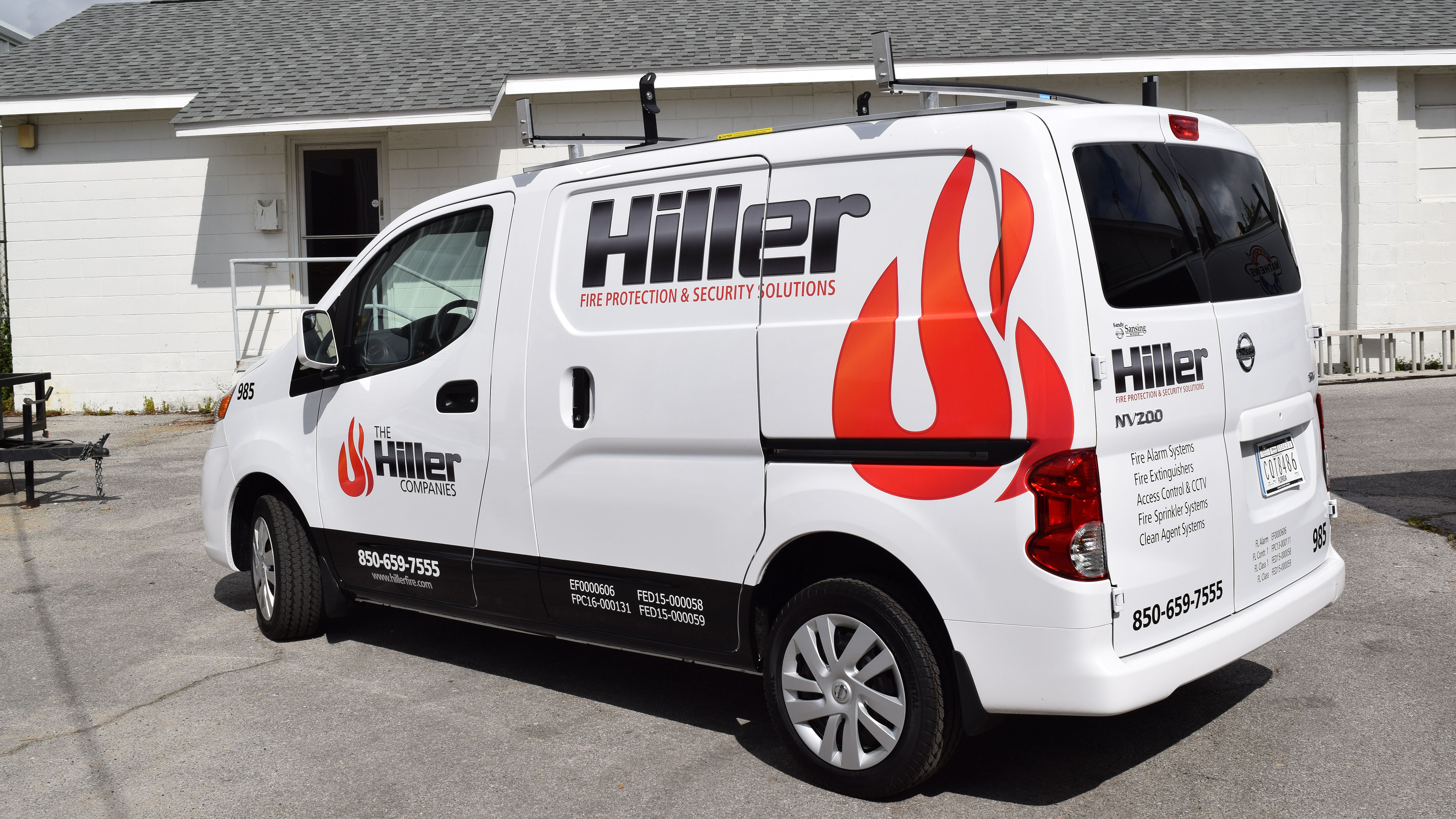 Vinyl fleet graphics on white Hiller company van by Pensacola Sign