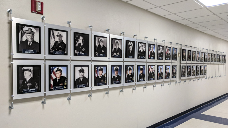 Custom built hanging hallway photo display for Naval Hospital Pensacola by Pensacola Sign