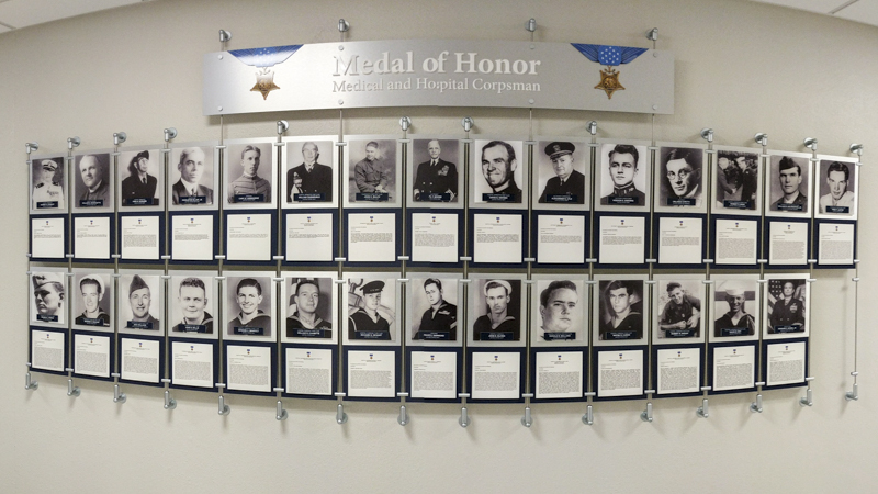 Custom built hanging hallway photo display for Naval Hospital Pensacola by Pensacola Sign