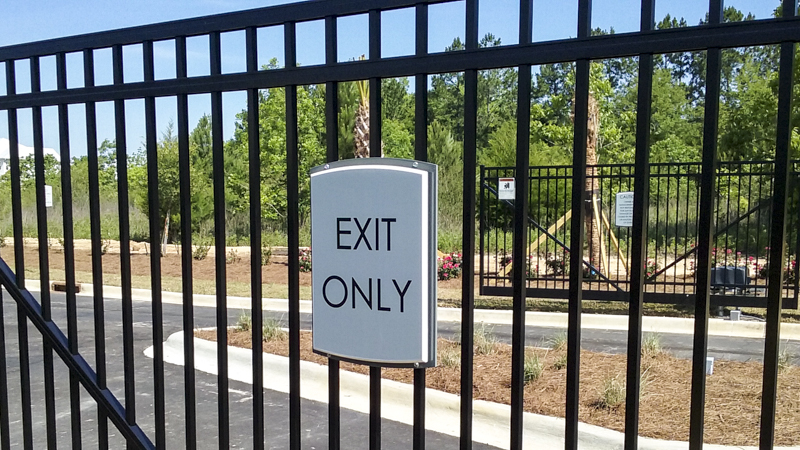 Apartment building exterior wayfinding by Pensacola Sign