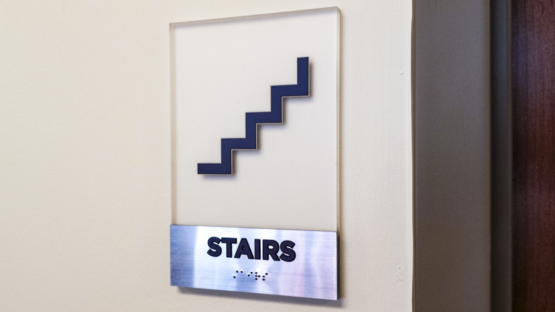 Stairs ADA compliant wayfinding by Pensacola Sign