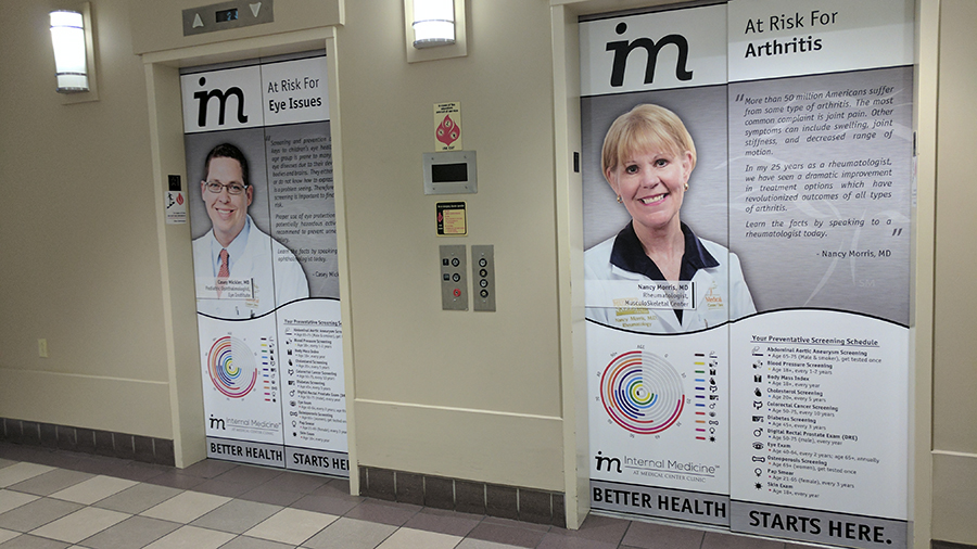 Elevator door wraps - Pensacola Sign Environmental Graphics